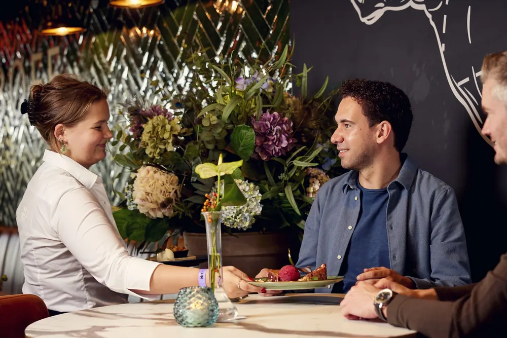 Guests being served in restaurant BØFF