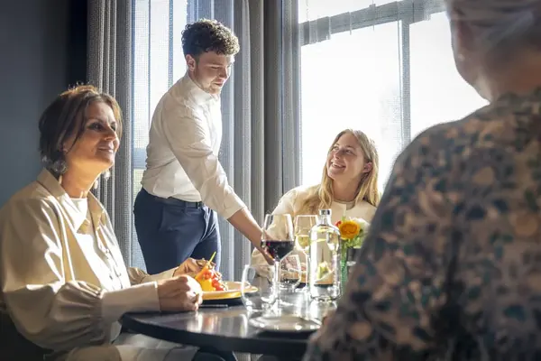 Dinner being served at the table in restaurant BØFF
