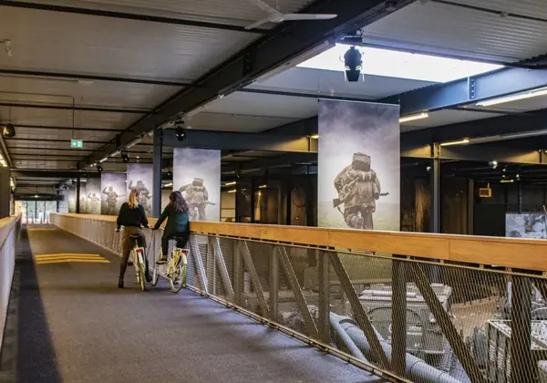 Cyclists on the bridge through the Overloon War Museum