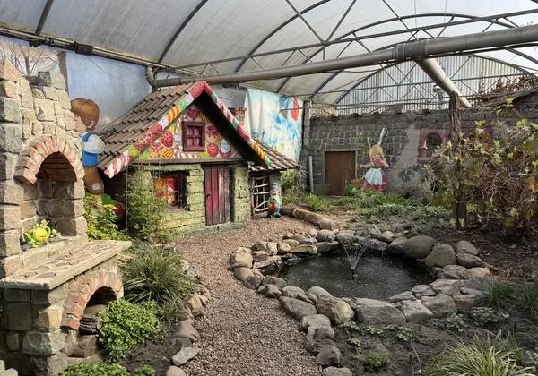 Fairy-tale cottage and small pond in the former strawberry greenhouse of Aardbeienland