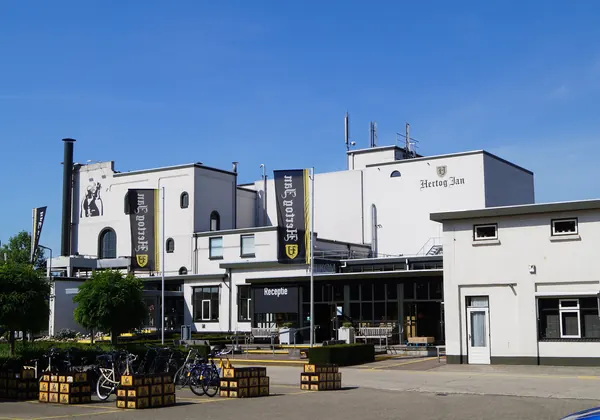 The white buildings of the Hertog Jan Brewery on the Kruisweg in Arcen