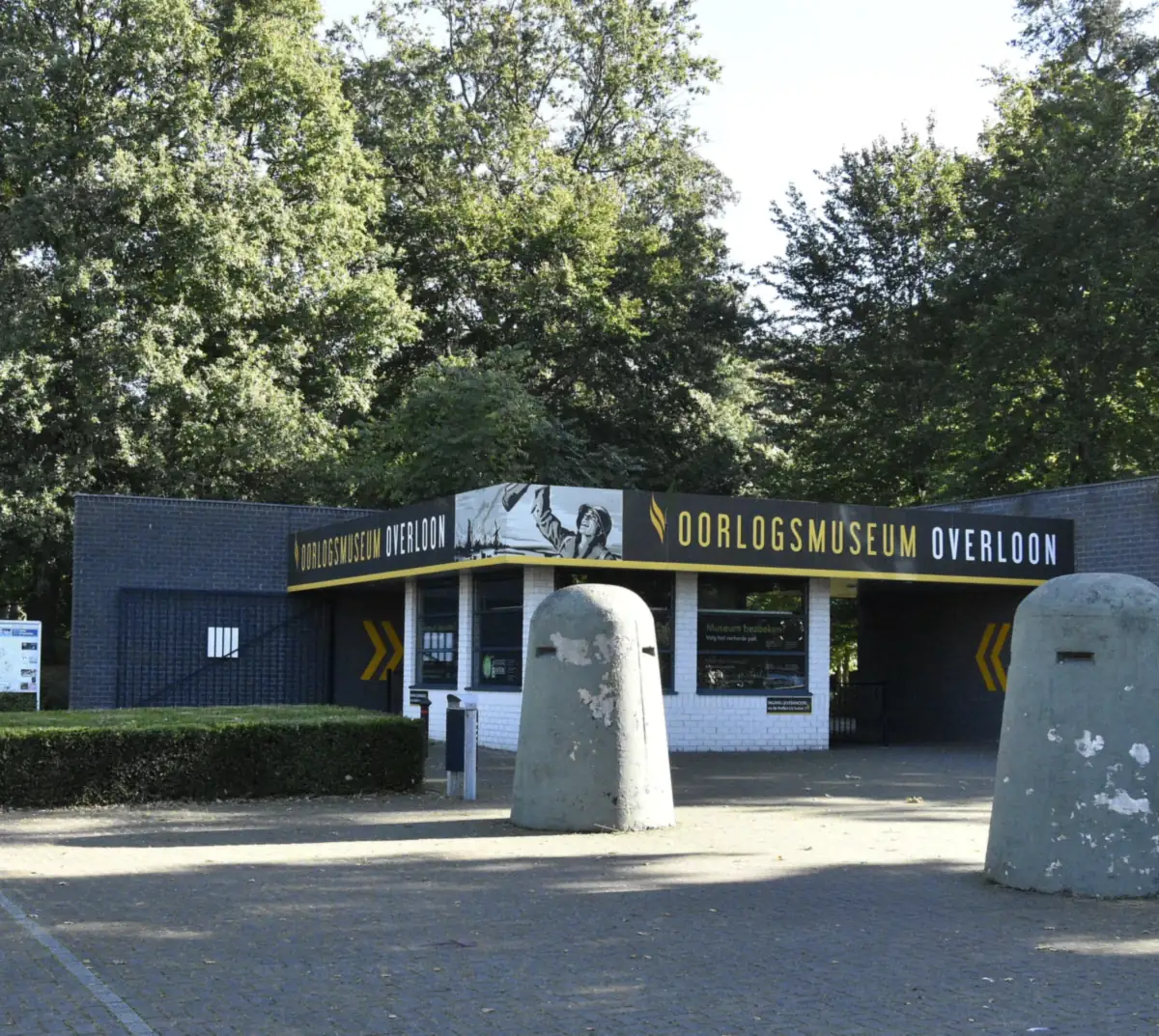 The entrance building of the Overloon War Museum with two concrete bunker domes